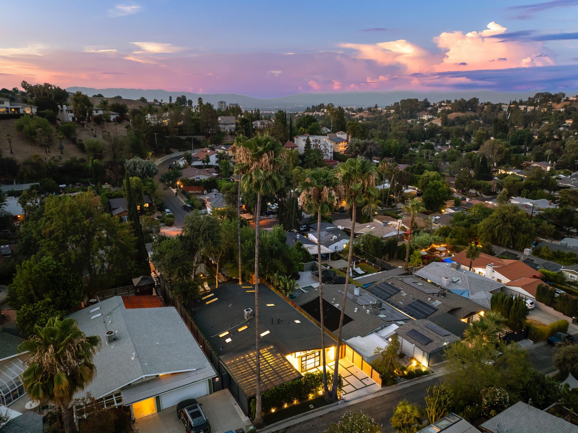 Spa-grade primary bathroom with floating vanity, soaking tub, and full-height tiled wet room.